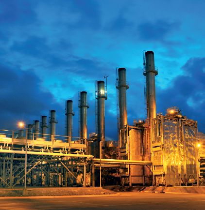 Thermal power plant lit at dusk